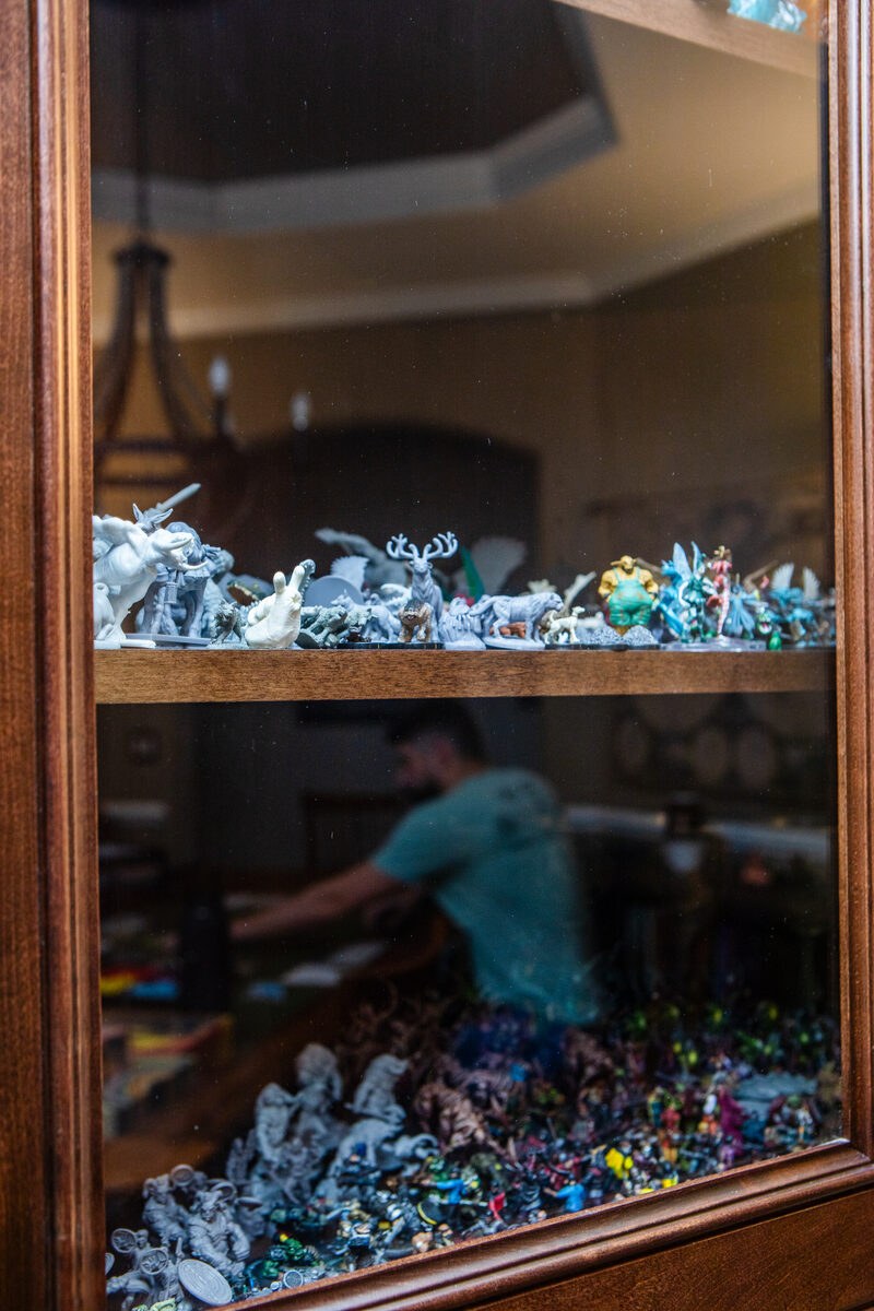 Wall display — breastplate, morion helmet, polearms, and drinking horn