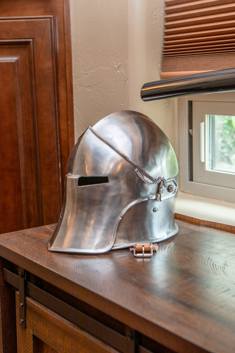 Sallet helmet close-up on cabinet shelf