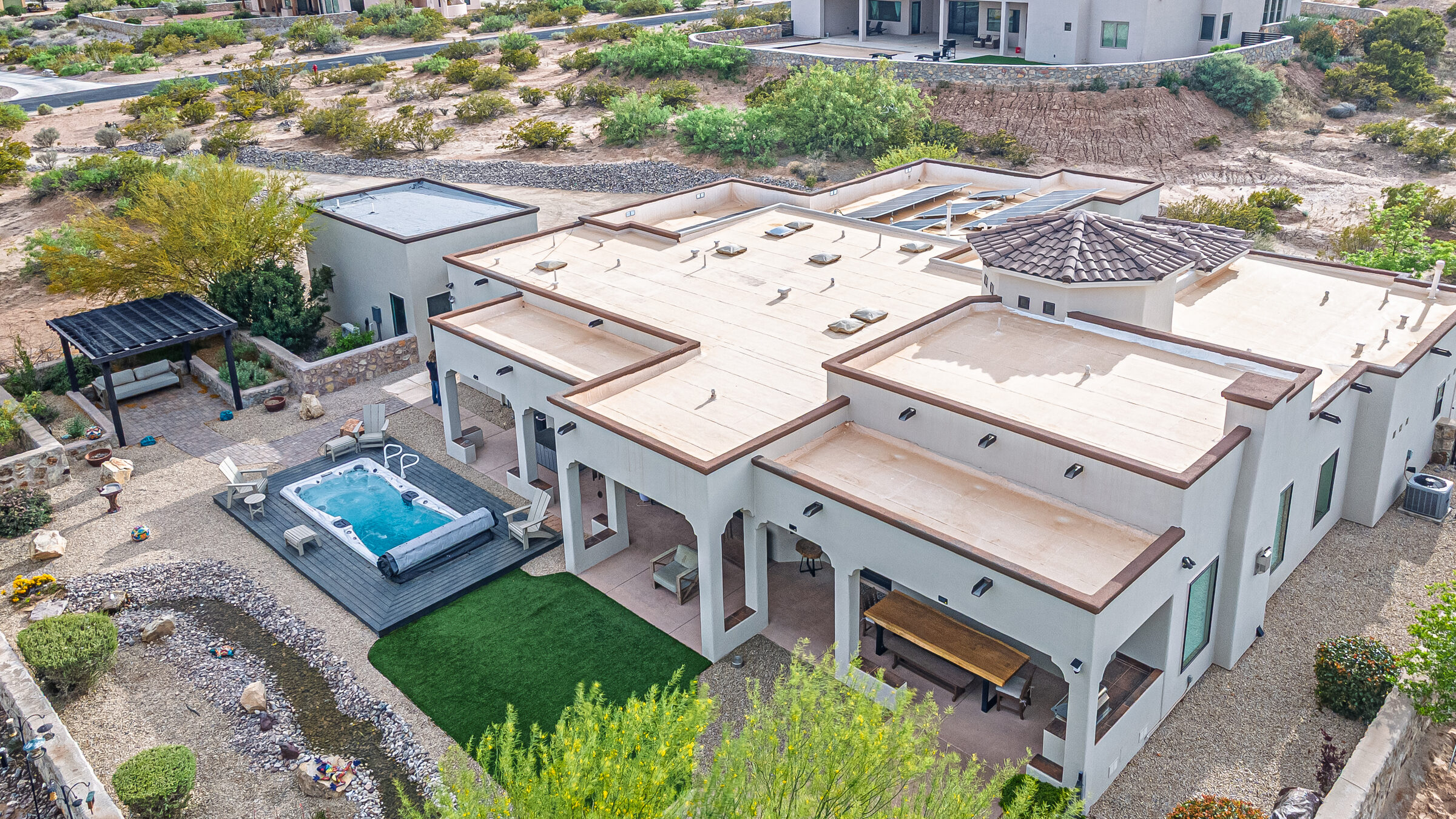 Backyard — swim spa, covered patio, and casita